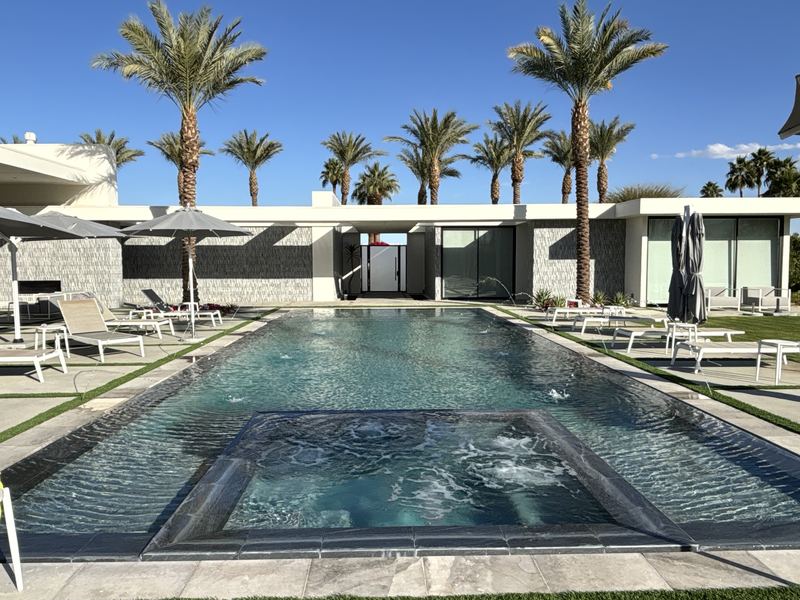 Pool with spa and palms